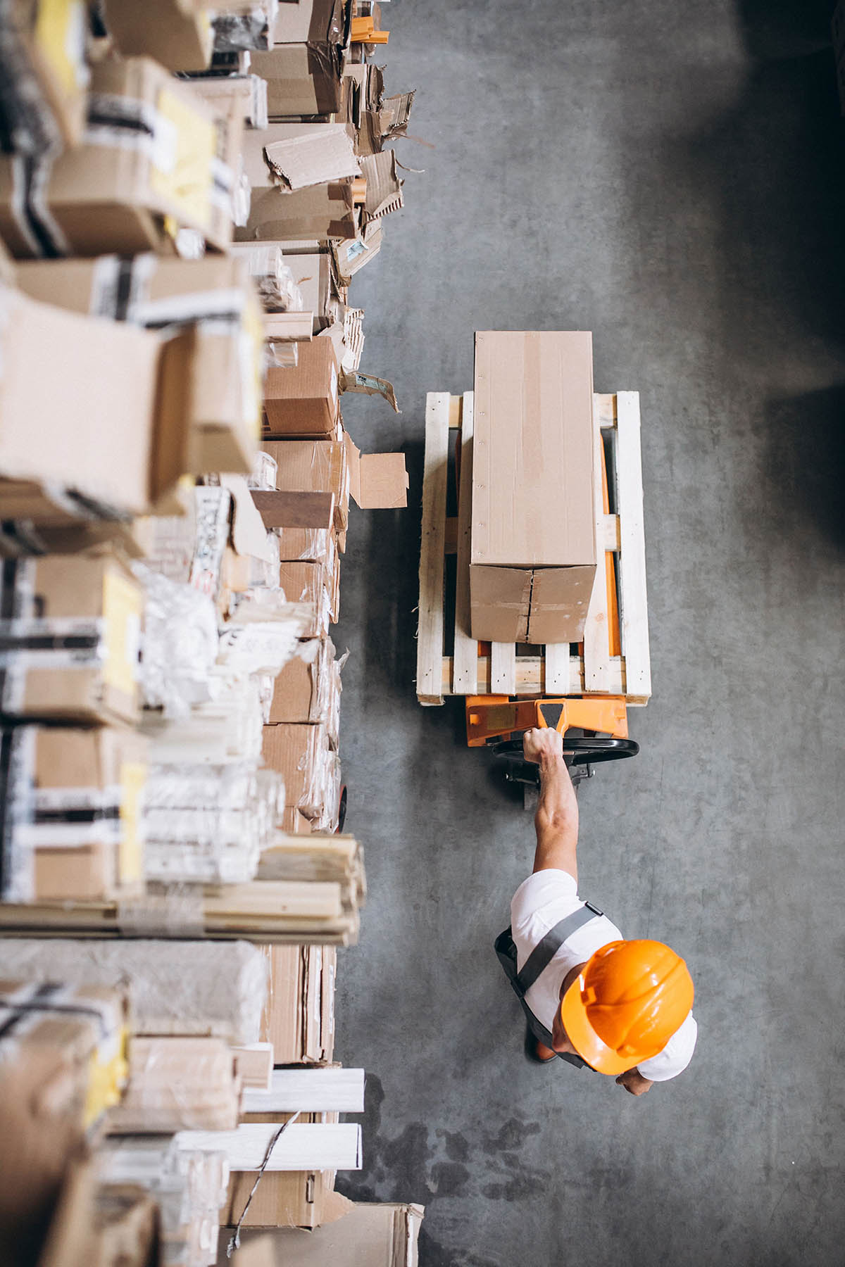 Young man working at a warehouse with boxes Young man working at a warehouse with boxes